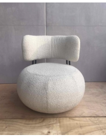 Used upholstered armchair, rounded shape, white boucle upholstery