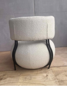Used upholstered armchair, rounded shape, white boucle upholstery