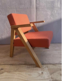 Used Noti Clapp armchair, orange upholstery, black wooden legs