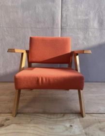 Used Noti Clapp armchair, orange upholstery, black wooden legs