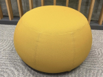 Używana pufa Arper żółta śr. 50 cm