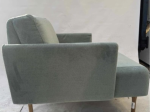 Używany fotel głęboki Muse NOTI szałwiowy, drewniane nogi