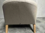 Używany fotel tapicerowany NOTI MULA beżowy, drewniane nogi